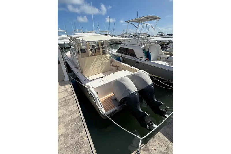 Slide: The Image of 2008 Grady-White Marlin 300 boat docked with twin outboard engines. - 3