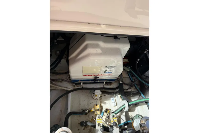 Slide: The Image of Engine compartment of 2008 Grady-White Marlin 300 boat, featuring Fischer Panda generator. - 6