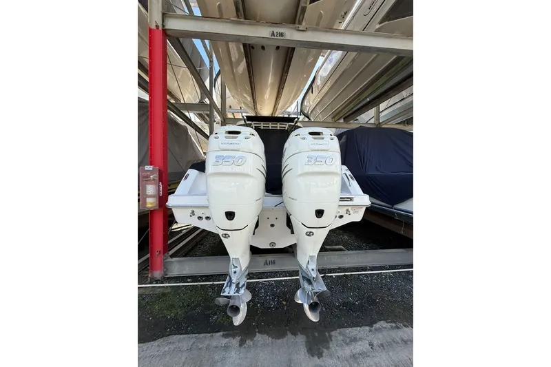 Slide: The Image of 2016 Boston Whaler 330 Outrage with twin 350 Verado engines in storage. - 14