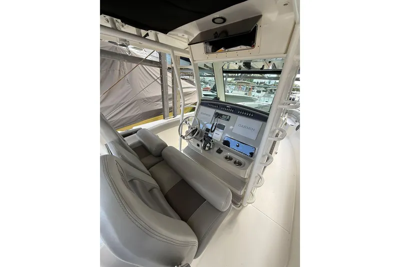 Slide: The Image of 2016 Boston Whaler 330 Outrage helm with Garmin navigation system and comfortable seating. - 5