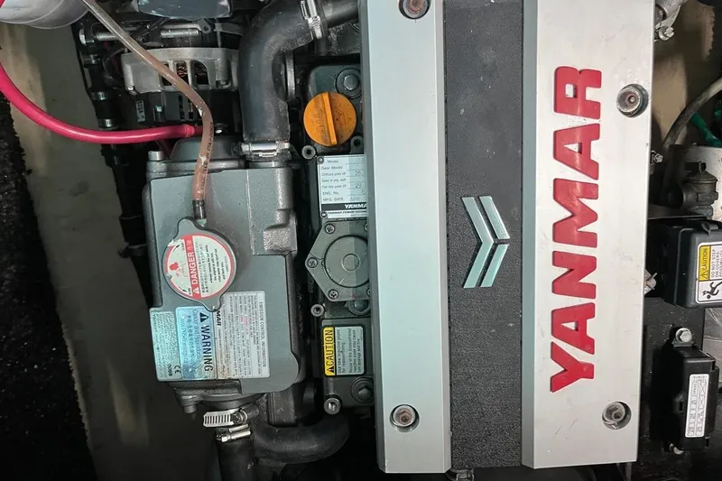Slide: The Image of Yanmar engine in a 2004 Island Spirit 400 sailboat, showcasing detailed components. - 19