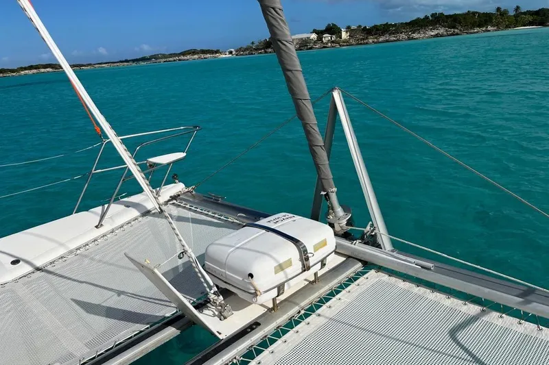Slide: The Image of 2004 Island Spirit 400 catamaran on turquoise waters, scenic coastal view. - 23