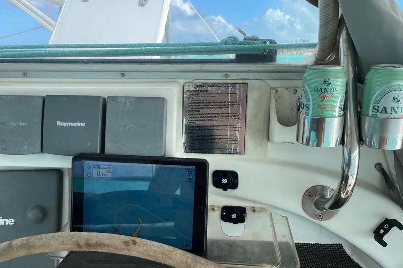 Slide: The Image of Cockpit of 2004 Island Spirit 400 with navigation equipment and drinks. - 26