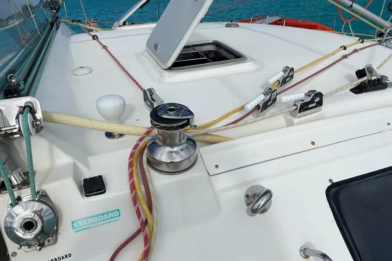 Slide: The Image of Deck of 2004 Island Spirit 400 sailboat with winch and ropes. - 39