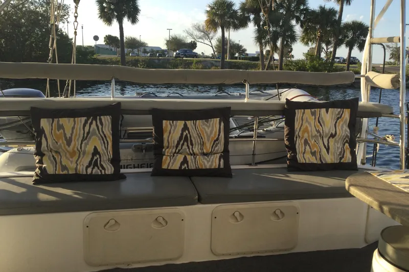 Slide: The Image of Cozy seating area on 2004 Island Spirit 400 yacht with decorative cushions. - 8