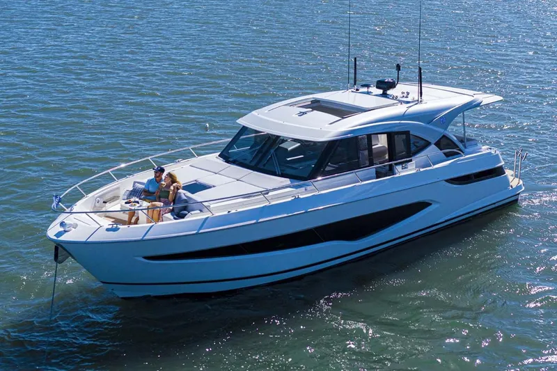 Slide: The Image of Manufacturer Provided Image: 2026 Riviera 4300 Sport Express yacht cruising on open water. - 1