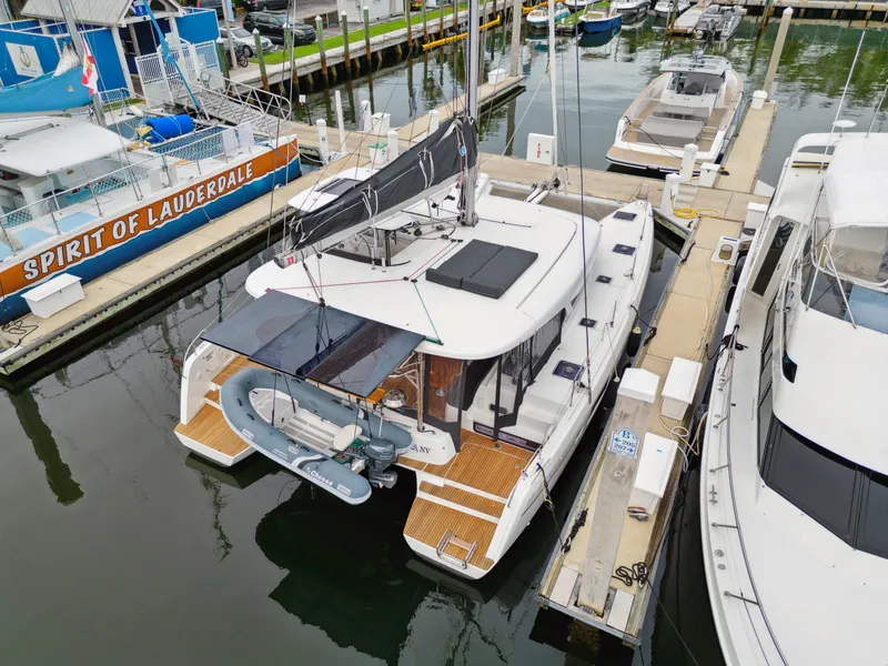 Slide: The Image of 2019 Lagoon 42 catamaran docked at marina. - 11
