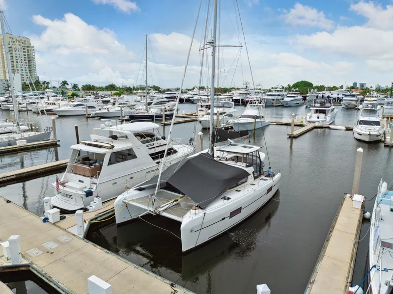 Slide: The Image of 2019 Lagoon 42 catamaran docked in marina. - 2