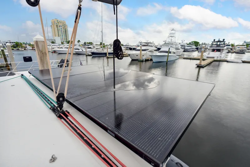 Slide: The Image of 2019 Lagoon 42 catamaran docked at marina. - 44