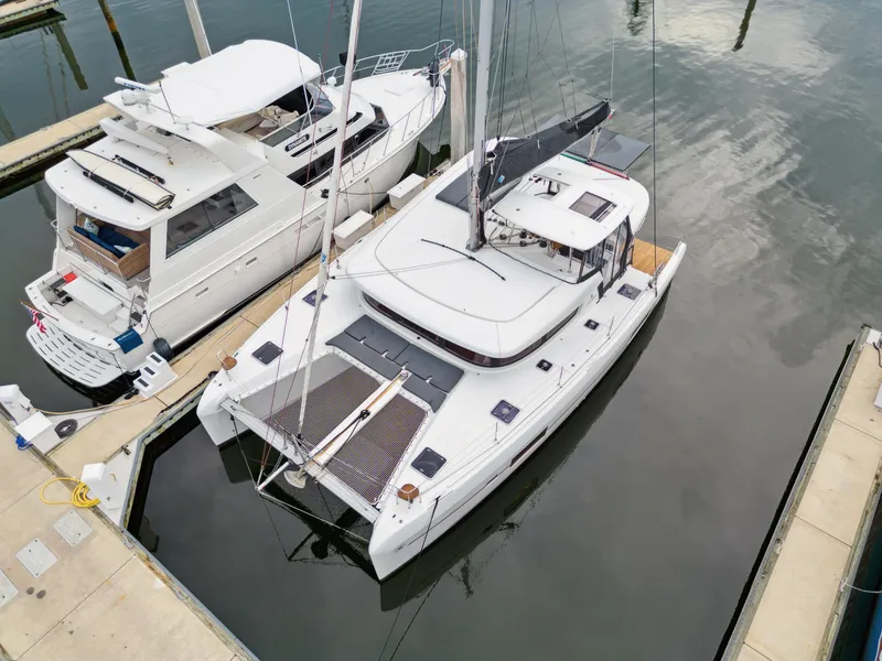 Slide: The Image of Aerial view of a 2019 Lagoon 42 yacht in the marina. - 9