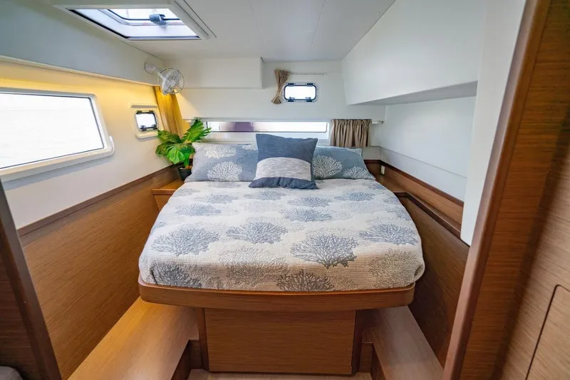 Slide: The Image of Luxurious interior of 2018 Lagoon 42 catamaran with modern furnishings and ample storage. - 12