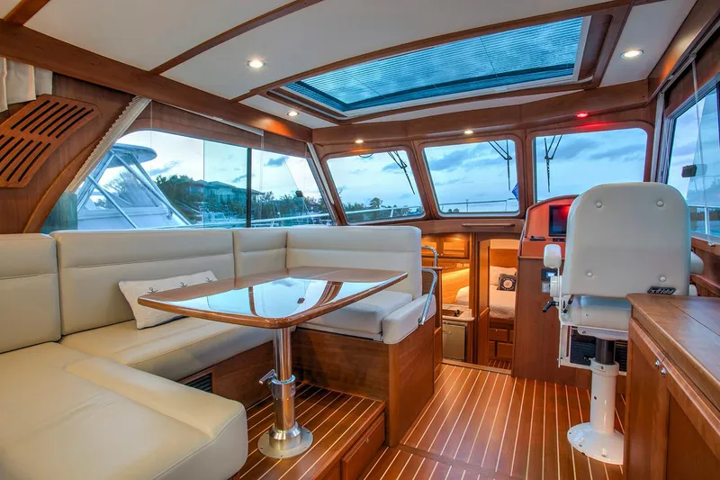 Slide: The Image of Manufacturer Provided Image: Interior of 2026 Sabre 38 Salon Express yacht with elegant wood finish and panoramic windows. - 2