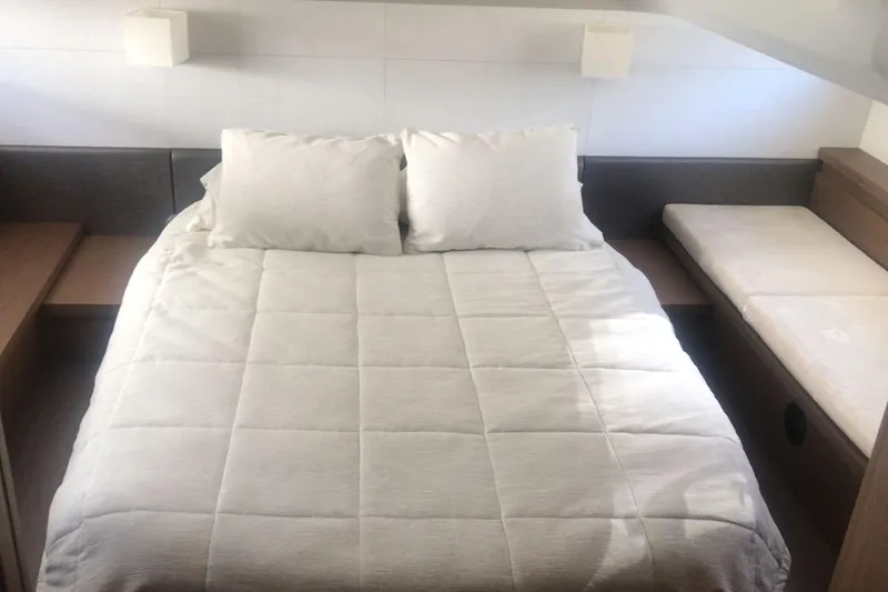 Slide: The Image of Luxurious bedroom interior of 2020 Beneteau Gran Turismo 46 yacht with cozy bedding. - 19