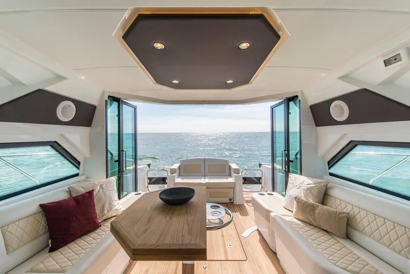 Slide: The Image of 2020 Beneteau Gran Turismo 46 yacht docked at marina under blue sky. - 25