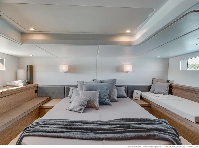 Slide: The Image of Luxurious cabin interior of 2020 Beneteau Gran Turismo 46 yacht with cozy bedding. - 28
