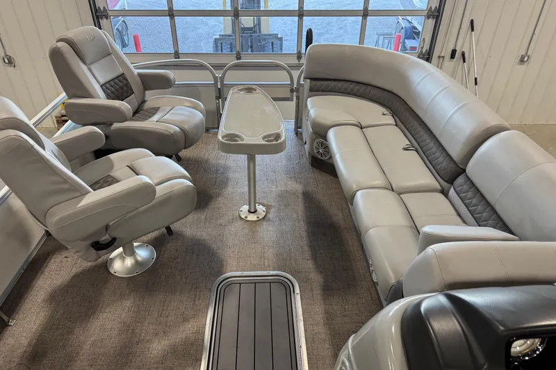 Slide: The Image of Luxurious interior of 2022 Ranger 223FC boat with plush seating and table. - 6