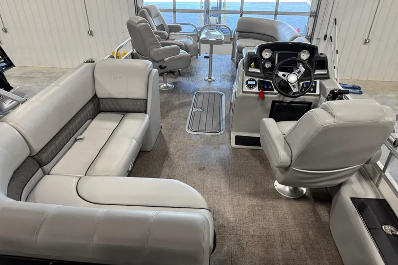 Slide: The Image of Interior of 2022 Ranger 223FC boat with plush seating and modern dashboard. - 9