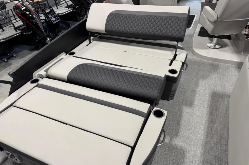 Slide: The Image of 2026 Sylvan L-5 Platinum boat interior with adjustable seating and cup holders. - 10