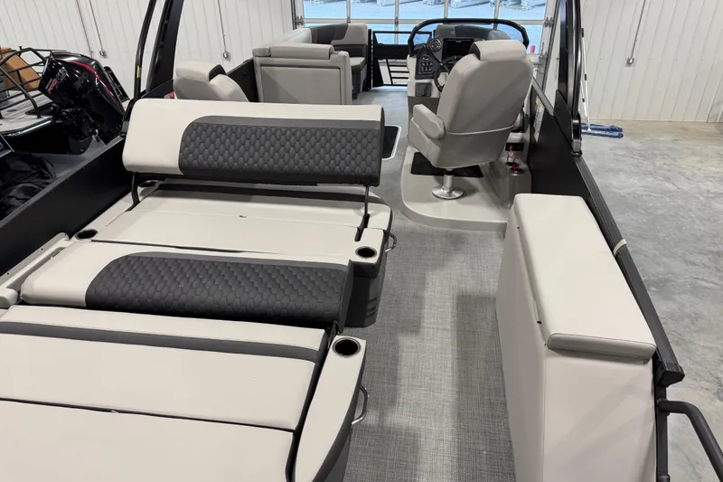 Slide: The Image of 2026 Sylvan L-5 Platinum boat interior with luxurious seating and modern helm. - 6