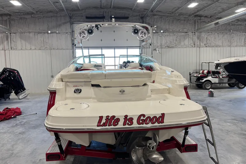 Slide: The Image of 2006 Monterey 234FS boat in a garage with "Life is Good" text on the stern. - 5