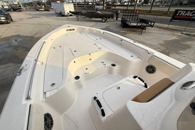 Slide: The Image of 2026 Sea Chaser 23 LX boat interior with spacious deck and storage compartments. - 12