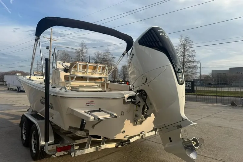 Slide: The Image of 2026 Sea Chaser 23 LX boat on trailer with Honda outboard motor. - 5