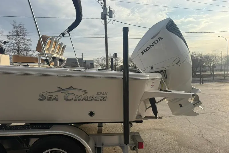 Slide: The Image of 2026 Sea Chaser 23 LX boat with Honda outboard motor on trailer. - 6