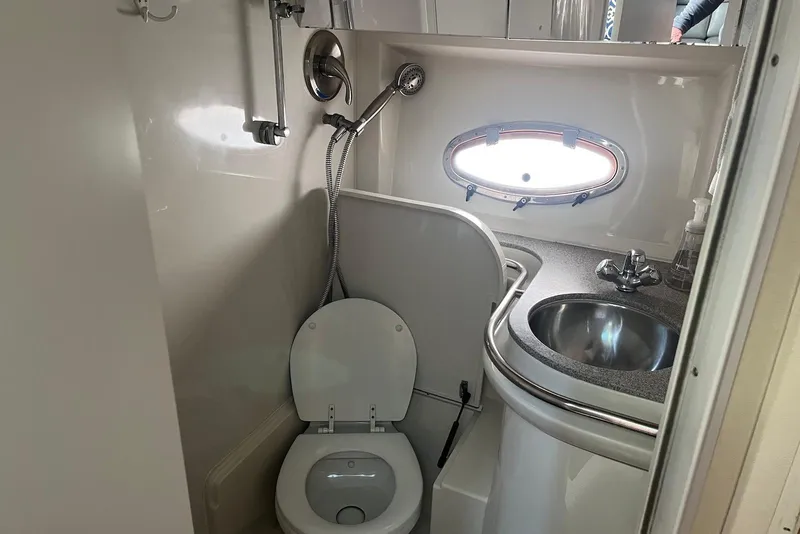 Slide: The Image of Luxurious interior of 1996 Trojan 440 Express Yacht with elegant seating and decor. - 14