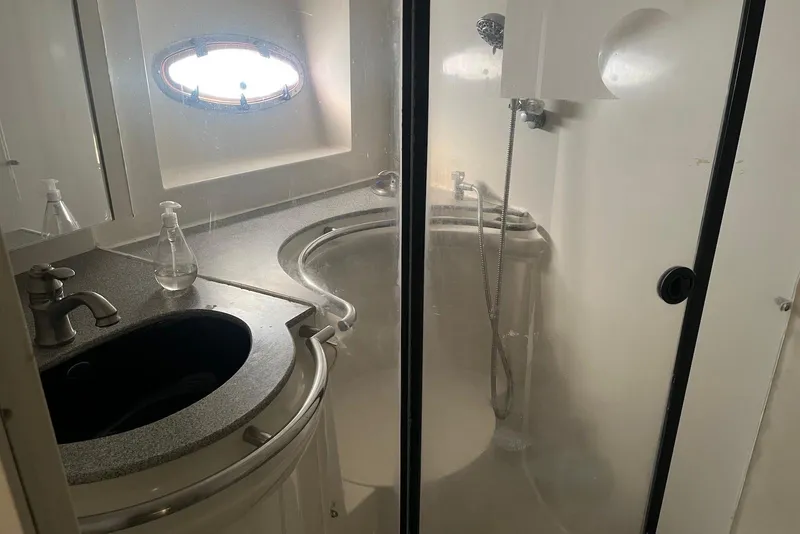 Slide: The Image of Interior of 1996 Trojan 440 Express Yacht kitchen with appliances and modern amenities. - 15