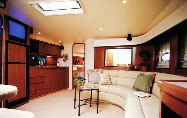 Slide: The Image of Luxurious 1996 Trojan 440 Express Yacht interior with plush seating and stylish decor. - 4
