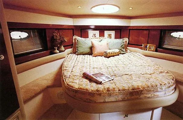 Slide: The Image of 1996 Trojan 440 Express Yacht cockpit with white seating and control panel. - 6