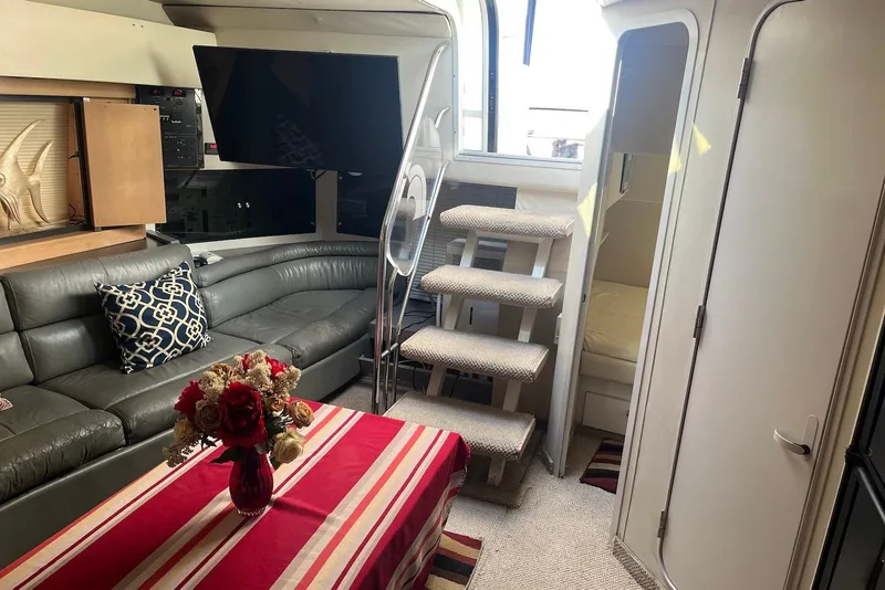 Slide: The Image of 1996 Trojan 440 Express Yacht cockpit with steering wheel and control panel. - 8