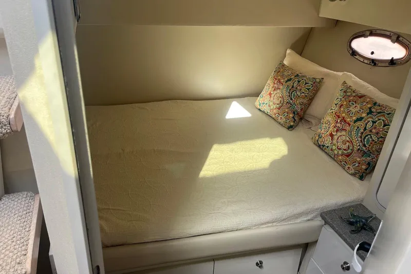 Slide: The Image of 1996 Trojan 440 Express Yacht deck with mounted equipment and railing. - 12