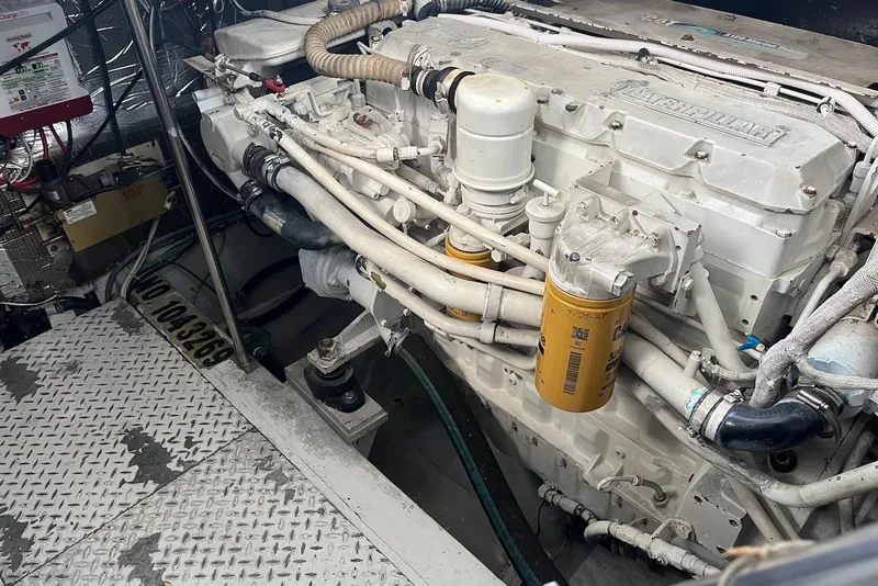 Slide: The Image of Cozy bedroom in 1996 Trojan 440 Express Yacht with colorful bedding and modern decor. - 17