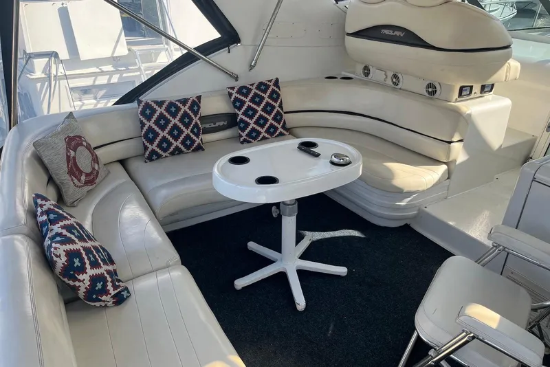 Slide: The Image of Luxurious interior of a 1996 Trojan 440 Express Yacht with plush seating and modern amenities. - 3