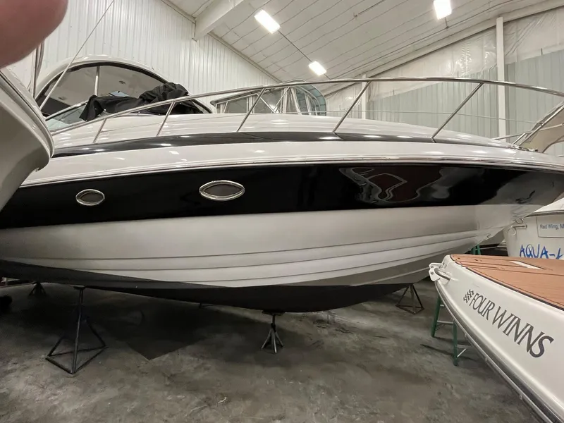 The Image of 2011 Crownline 350 CR boat in a storage facility. - 0