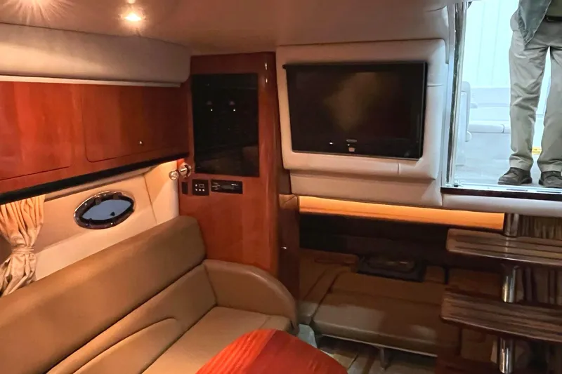 Slide: The Image of Interior of a 2011 Crownline 350 CR yacht with sofa and TV. - 15