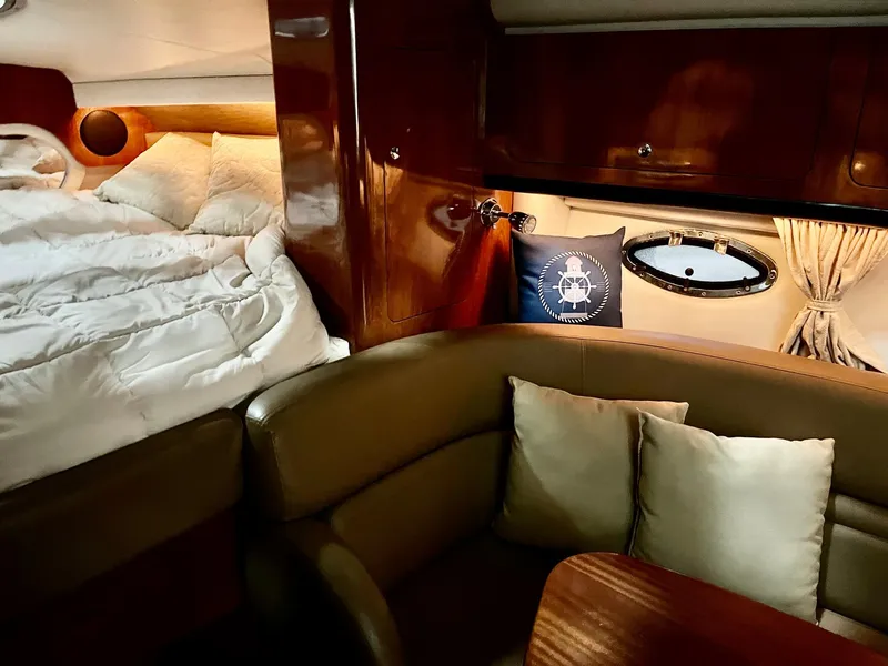 Slide: The Image of Interior of a 2011 Crownline 350 CR yacht with bed and seating area. - 18