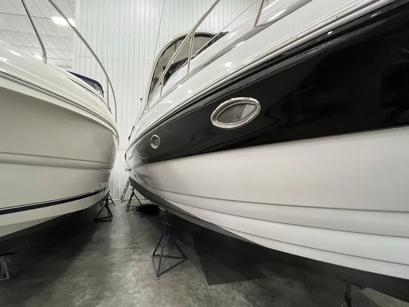 Slide: The Image of 2011 Crownline 350 CR boat in storage facility. - 2
