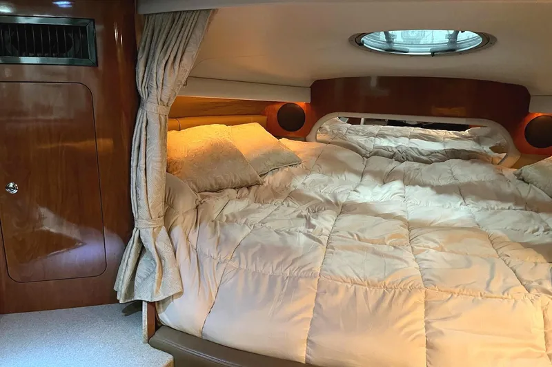 Slide: The Image of Luxurious bedroom in a 2011 Crownline 350 CR yacht. - 20