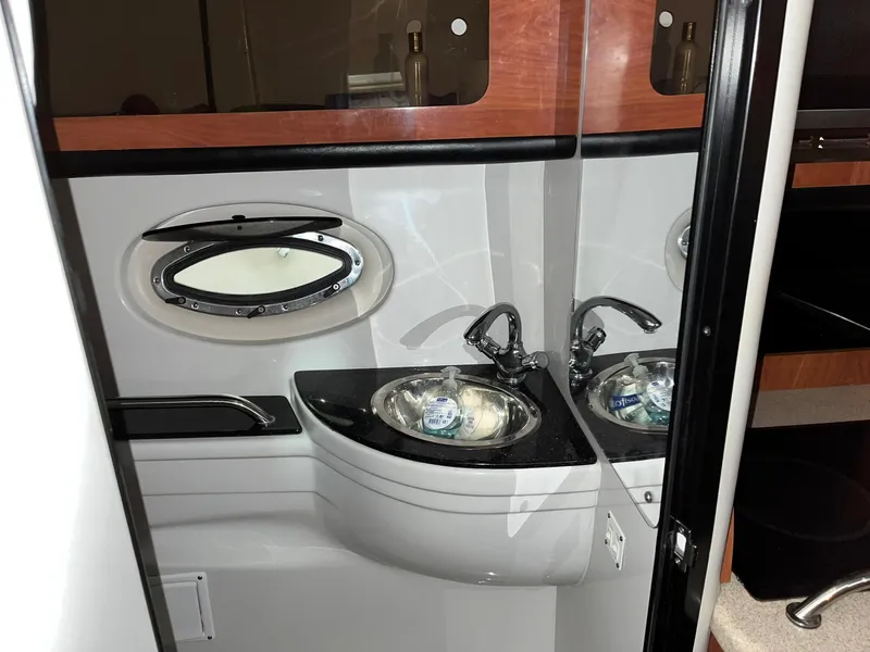 Slide: The Image of Interior of 2011 Crownline 350 CR with sink and porthole. - 26