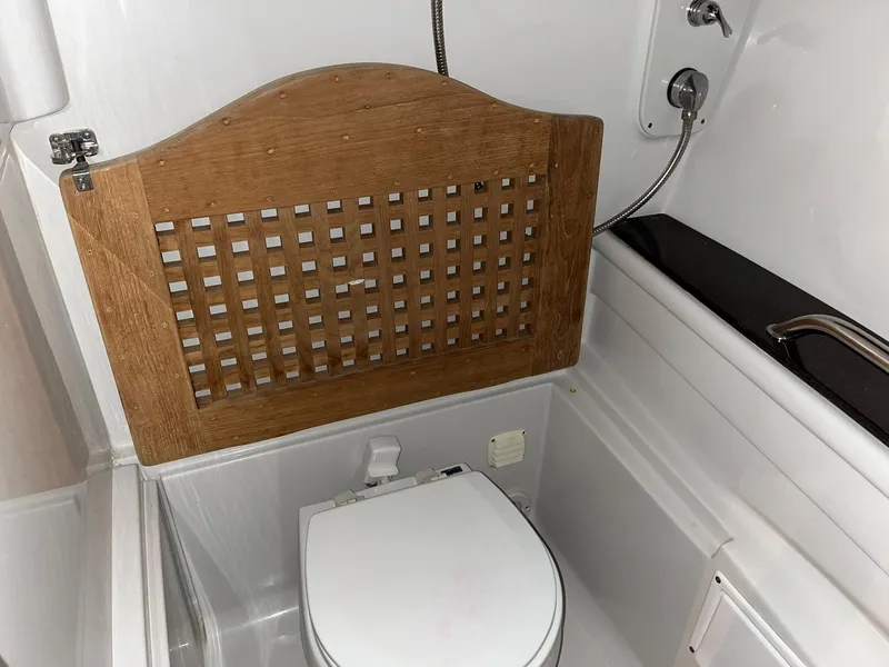 Slide: The Image of Bathroom in 2011 Crownline 350 CR boat. - 27