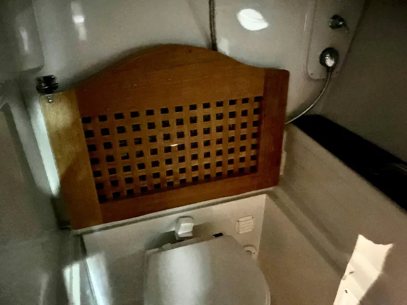 Slide: The Image of Interior of a 2011 Crownline 350 CR with wooden lattice. - 28