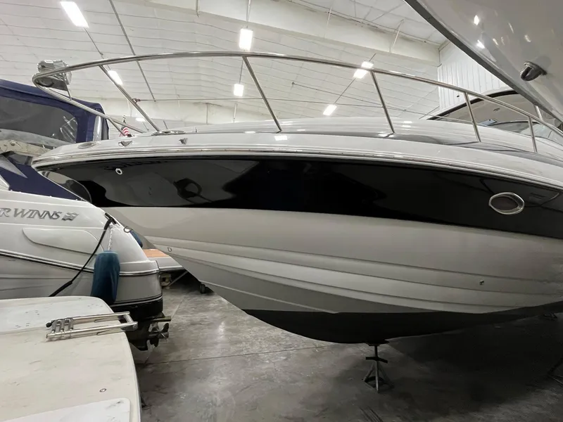 Slide: The Image of 2011 Crownline 350 CR boat in storage facility. - 3