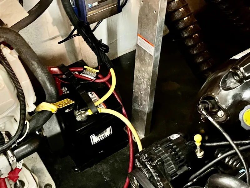 Slide: The Image of Engine compartment of 2011 Crownline 350 CR with battery and cables. - 37