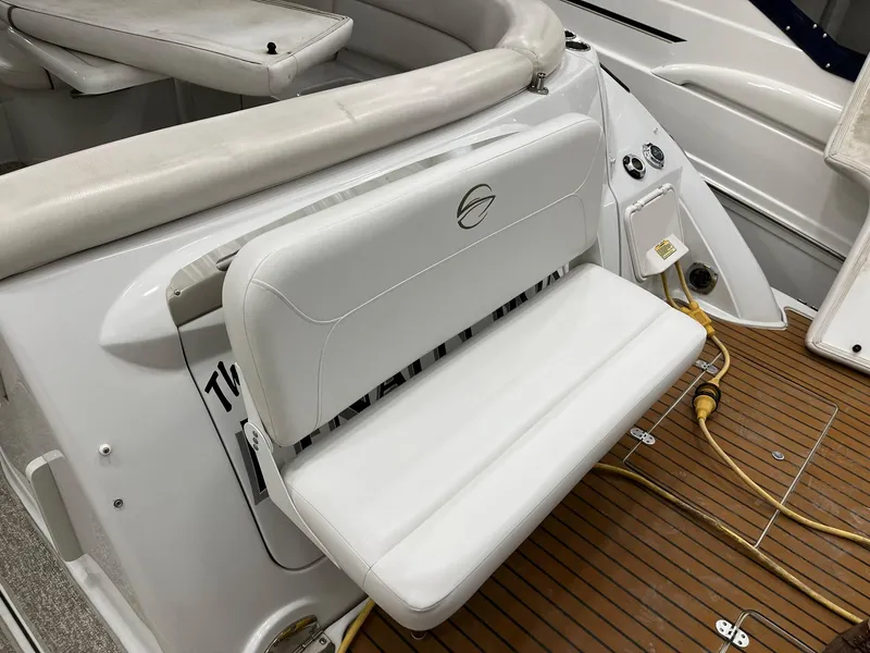Slide: The Image of 2011 Crownline 350 CR boat with white bench seat and teak flooring. - 6