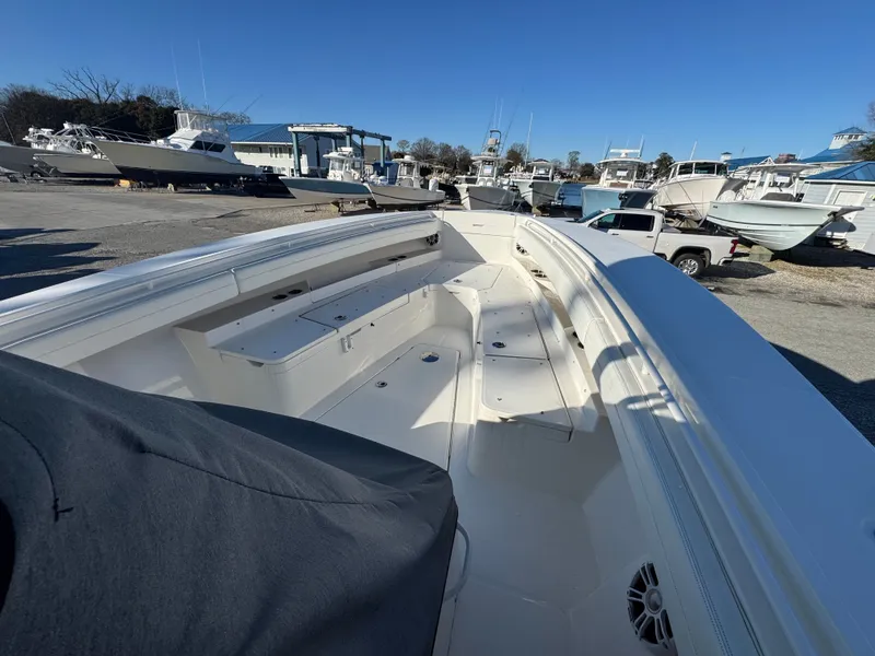 Slide: The Image of 2022 Regulator 31 boat on a lot with other boats. - 10