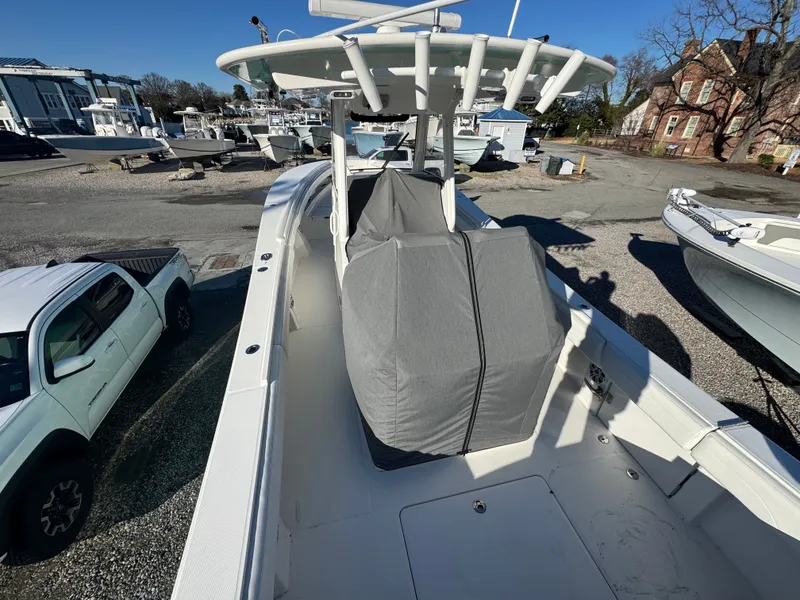 Slide: The Image of 2022 Regulator 31 boat parked with cover on. - 11