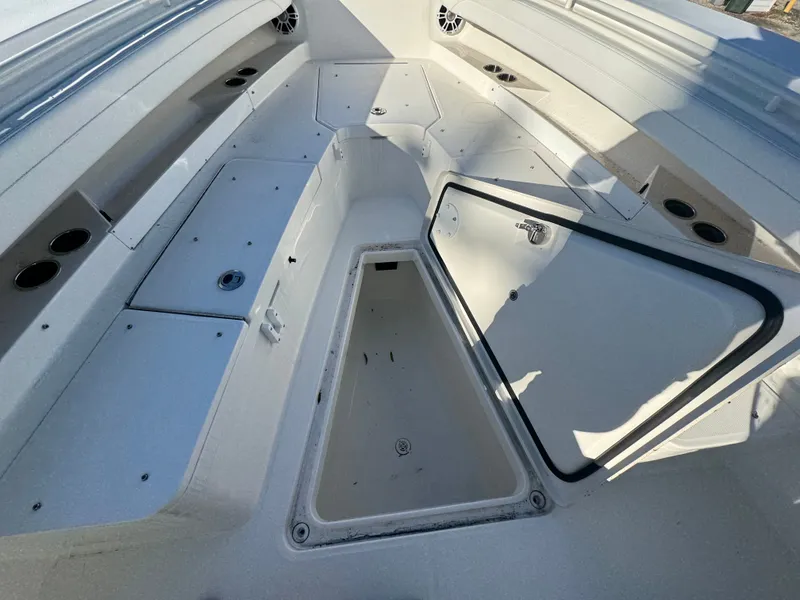 Slide: The Image of Open storage compartment on a 2022 Regulator 31 boat. - 15