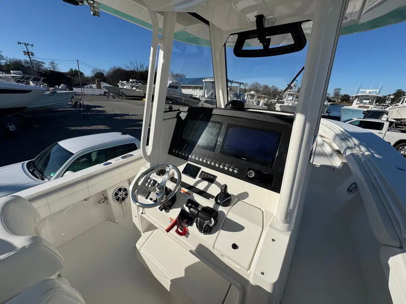 Slide: The Image of Interior view of 2022 Regulator 31 boat with modern helm console. - 20